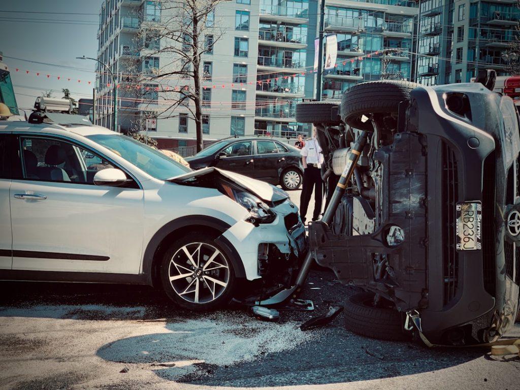 Life & Health 4 Rollover car crash automobile traffic accident broadside collision causing rollover with first responder firemen stabilization brace deployed.