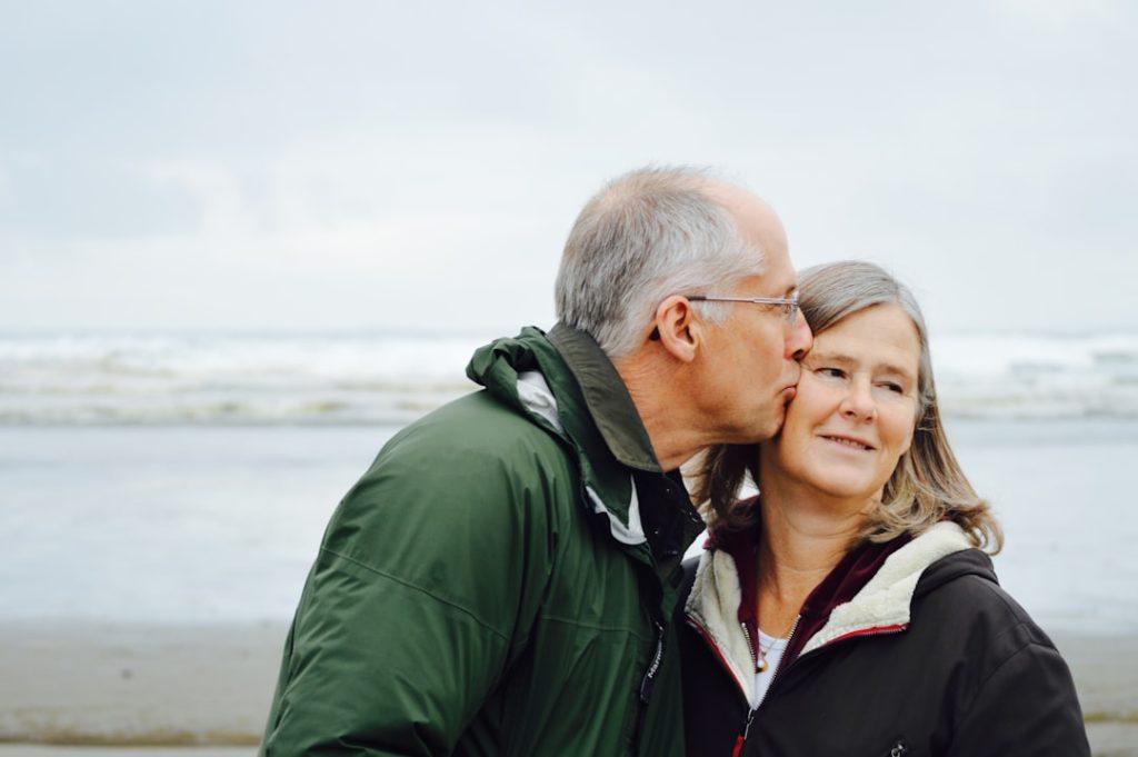 About 1 These are my parents. This photo was taken Christmas and even though my mom squeamishly refused to kiss my dad, my dad took the opportunity and this photo was the result.